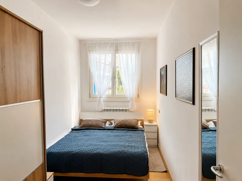 Bedroom with built-in wardrobe and natural light
