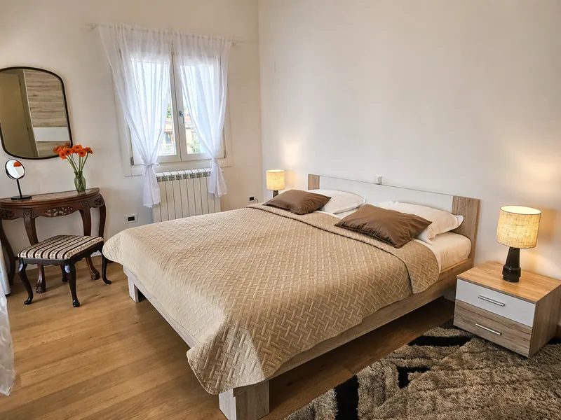 Bedroom with dedicated workspace and natural light
