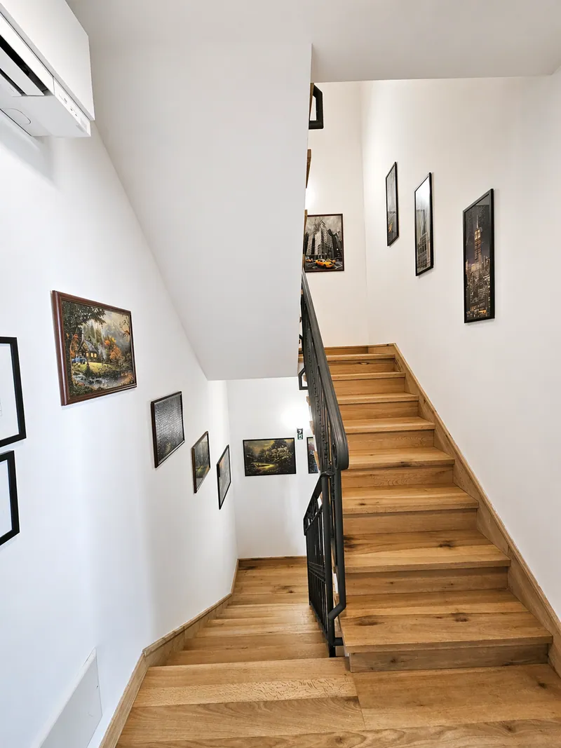 Staircase with framed artwork
